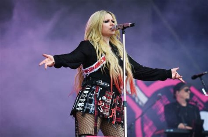 What is Avril Lavigne’s net worth? Fortune explored as singer locks lips with Tyga at Paris Fashion Week